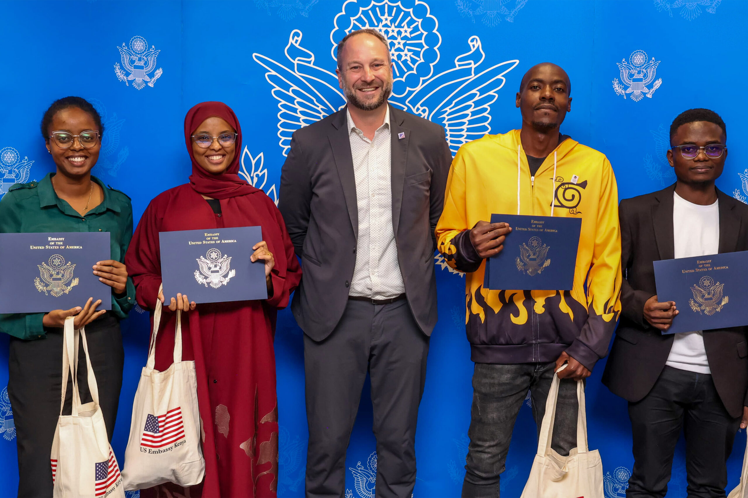 Medibora team members Jael Wainaina, Fardosa Mohammed, Cedric Mwanebetu, and Washinton Odiado pose alongside Mark Burrel (center), Regional Public Engagement Specialist at the U.S. Embassy in Nairobi, after emerging winners of the Stars of Innovation Challenge. Photo courtesy: Medibora