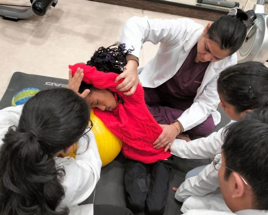 Nicolina, who is fighting a fever and living with the rare genetic condition, Marfan syndrome, pushes the food around her plate. Her flushed cheeks and restless movements betray her discomfort in the heavy, humid air.